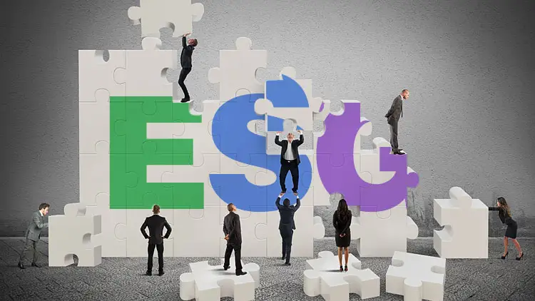 Business professionals assembling giant puzzle-piece letters spelling ESG